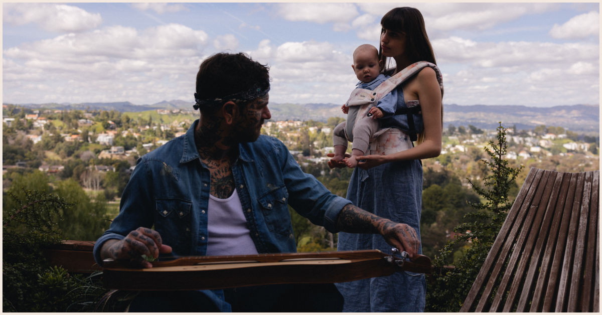 Fences musician with his wife and baby Moody in a Tula Mesh Explore baby carrier
