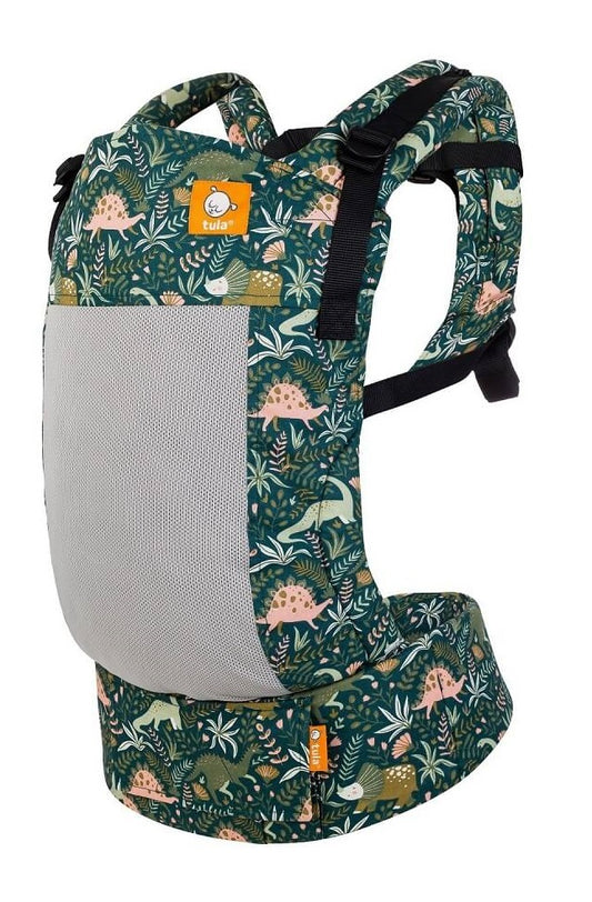 Free-to-Grow Carrier Coast Land Before Tula with a dinosaur print in emerald green and apricot. from Tula.