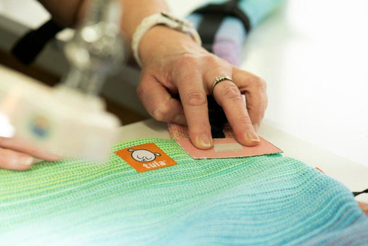 A closeup of a person working on a carrier from Tula.