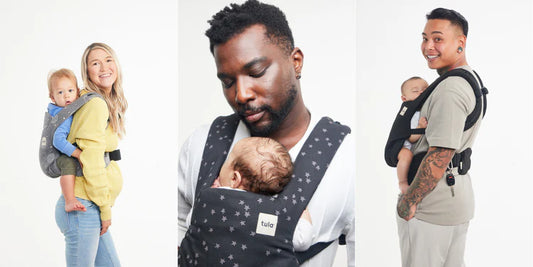 A mum  and two dads babywearing their children in Tula Explore Baby Carrier 