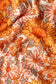 A close-up photo of Tula Sunflower Swaddle Blanket made from tencel