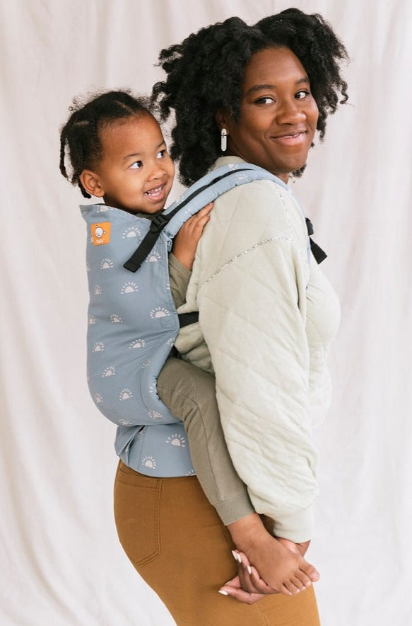 Tula Toddler Carrier Harbor Skies in a back carry position